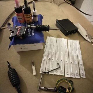 Photo of Tattoo gun with accessories...
