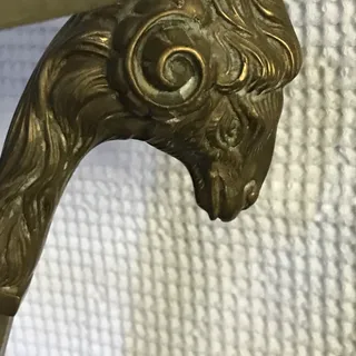 Photo of 1920s Bronze Ram head stand with glass top. Heavy tall small table/stand