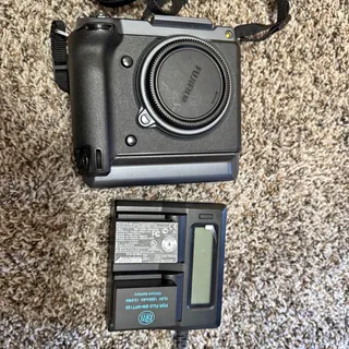Photo of Fuji GFX 100 with 4 batteries low shutter count