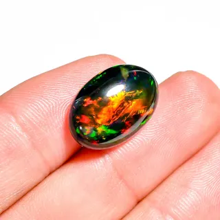 Photo of Oval Shape 7.00 Ct Black Ethiopian Opal Cabochon | High-Fire Natural Gem