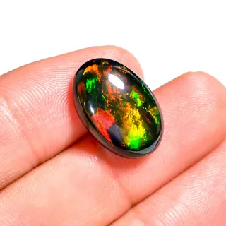 Photo of Oval Shape 7.00 Ct Black Ethiopian Opal Cabochon | High-Fire Natural Gem