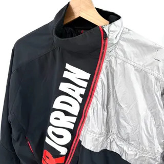 Photo of Air Jordan Black Silver Asymmetrical Zip Cropped Track Jacket