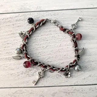 Photo of Silver Tone & Red Charm Bracelet