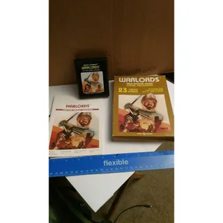 Photo of Warlords 23 game atari game cartridge with box and instructions