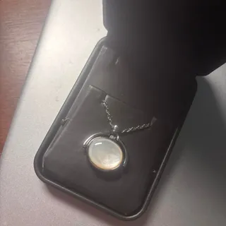 Photo of Silver tone pocket watch pendant