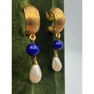 Photo of vintage Napier drop earrings feature a ribbed, textured gold-tone hoop base