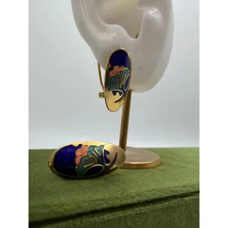 Photo of vintage oval cloisonné enamel earrings featuring a blue background