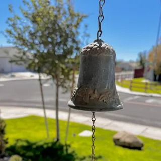 Photo of cast iron wall-mounted dinner entry door bell decorative branch leaf bracket VTG