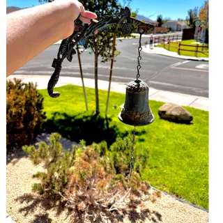 Photo of cast iron wall-mounted dinner entry door bell decorative branch leaf bracket VTG