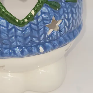 Photo of Snowman votive candle holder star-shaped cutouts heart cutout blue sweater 2002