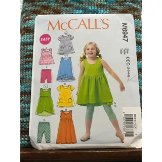 Photo of McCalls 6947 Sewing pattern Girls dress top shorts leggings size 2 3 4 5