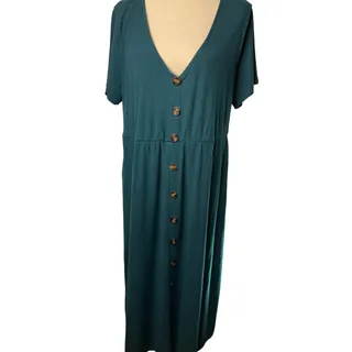 Photo of Hawthorn sleeveless dress in rich teal with a vibrant red, orange, and yellow floral print. Features a scoop neckline, relaxed blouson bodice, defined elastic waist, and knee-length skirt. Size Large. Feminine and easy to dress up or down. Style: Boho,