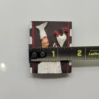 Photo of 3D chef Italian or French chef posing alongside a rooster 1.5” x 2” approx.