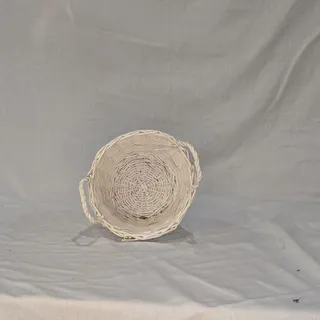 Photo of White wicker basket with handles