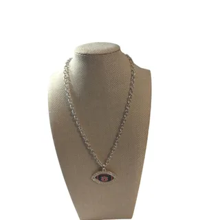 Photo of AU football shaped necklace. Silver necklace with rhinestones shaped like a football orange and blue. Necklace on silver chain.