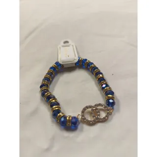 Photo of C Accessory blue and gold bracelet with white rhinestone