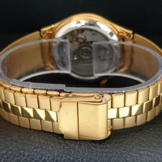 Photo of Vintage 1985 Seiko Automatic Mens Gold Watch W/daydate & Green accents