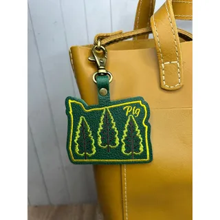 Photo of Portland Leather Bag Charm Oregon Purse Charm PNW Oregon Pebbled Gold Stitched