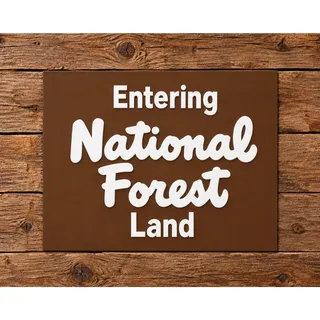Photo of ENTERING National Forest Land Road Sign National Park NPS Hike Trail Camp